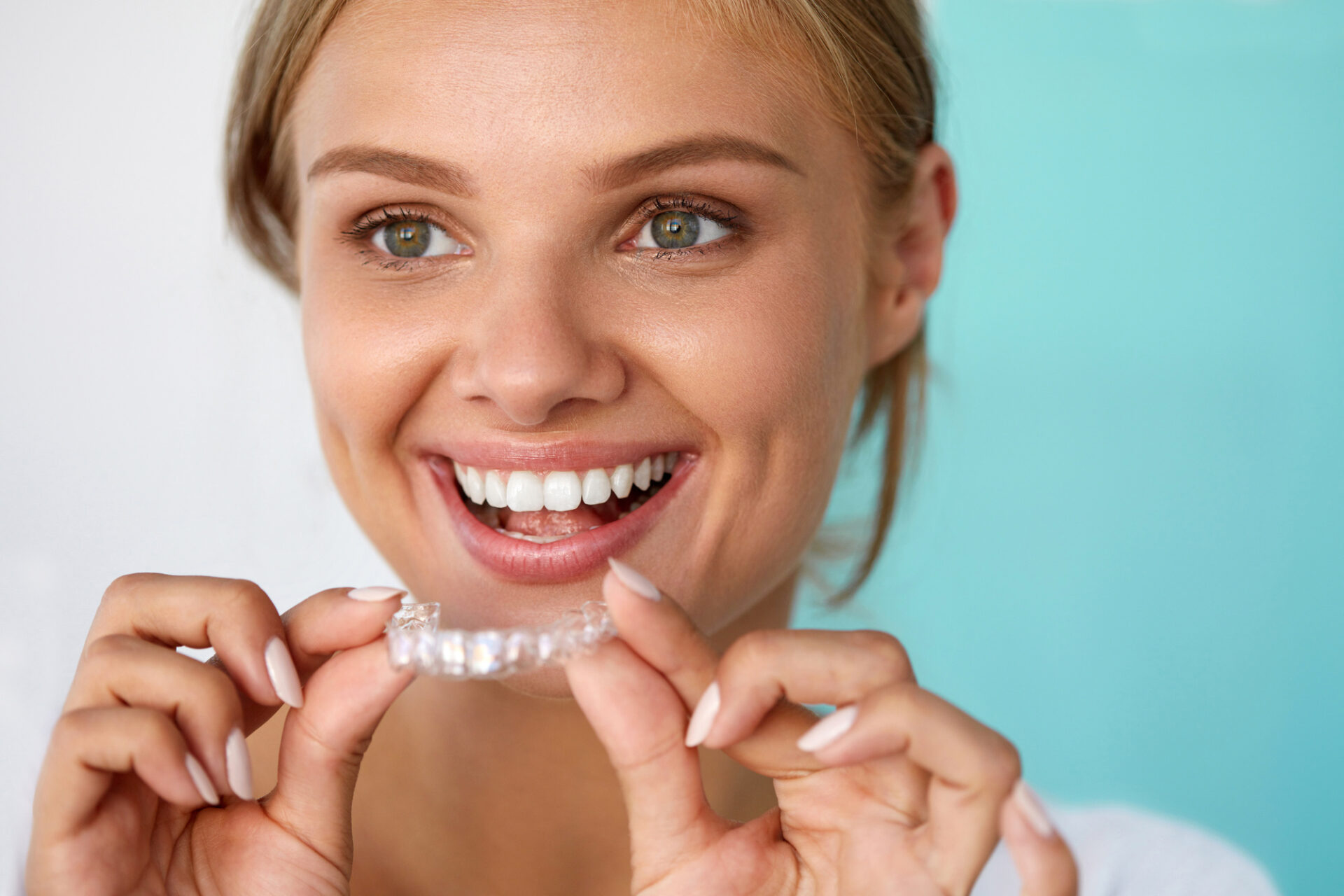 What is the difference in cost between braces and Invisalign?